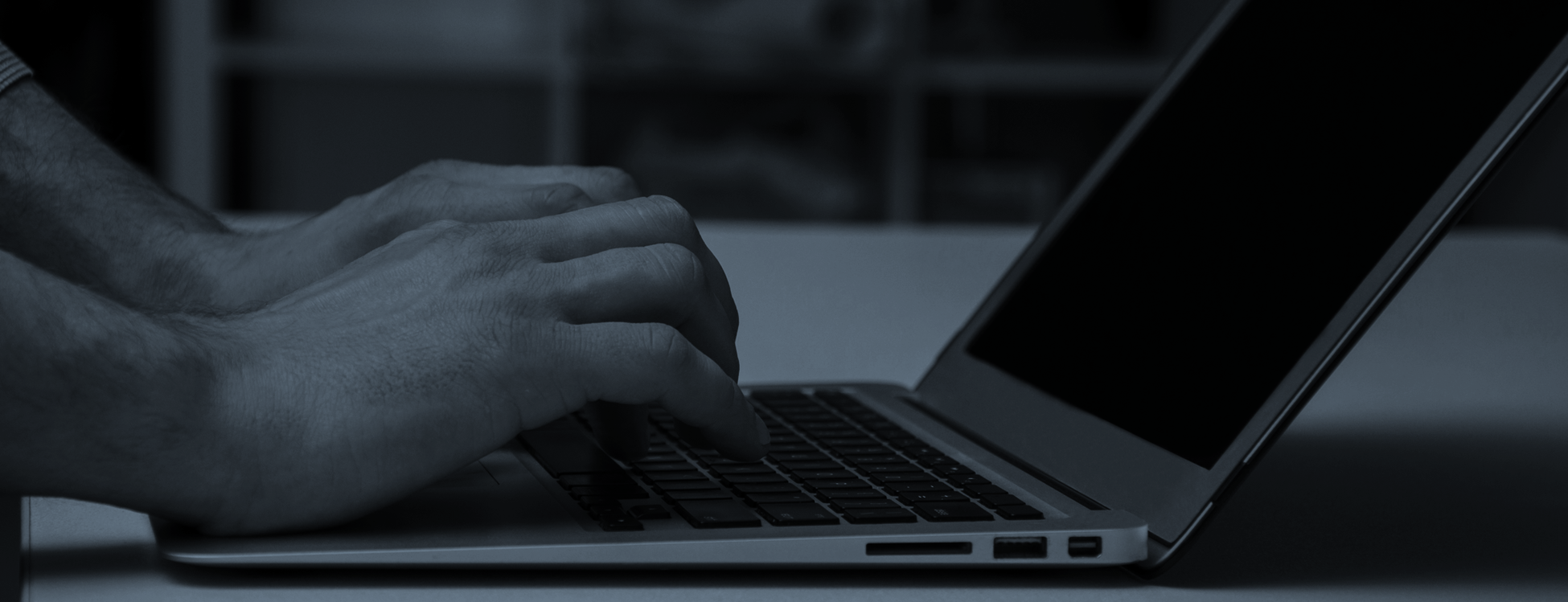 Laptop and hands using a digital check-in